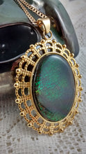 Load image into Gallery viewer, Oval Shaped Green Colored Ammolite in a Gold Colored Setting Necklace
