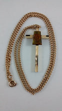 Load image into Gallery viewer, Ammolite stone glued on to gold colored cross with chain
