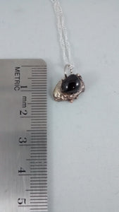 Size of silver and garnet pendant